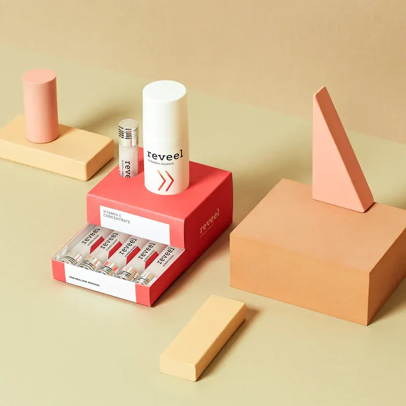 The Reveel vitamin C range, with its serum and ampoules arranged beside the box